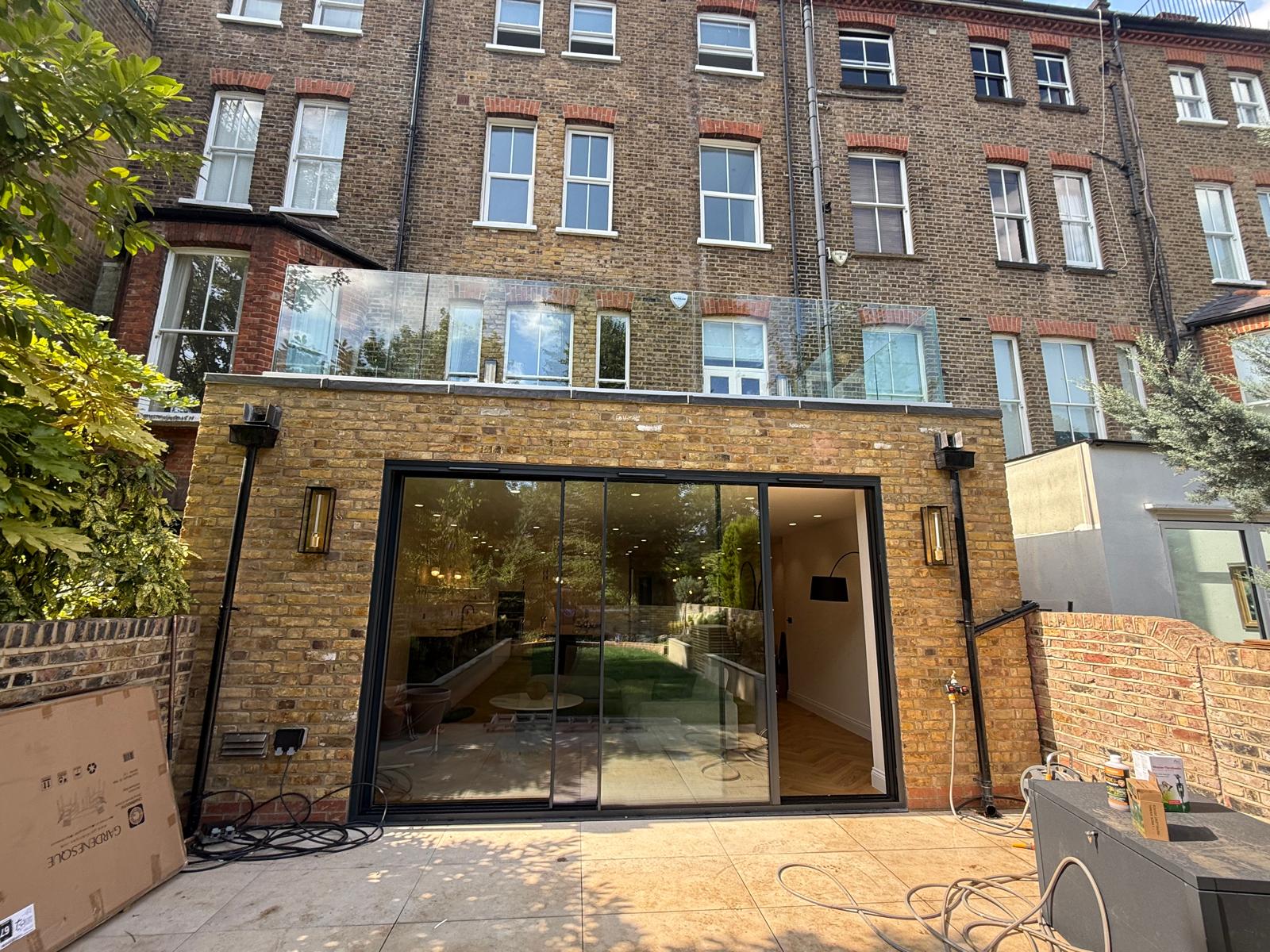 Glass rear extension with brick piers